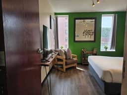 Downtown Apt | Queen Bed + 60” Smart TV - Image 5